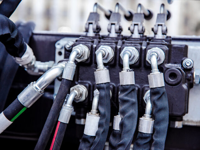 hydraulic hoses connected at shallow depth of field